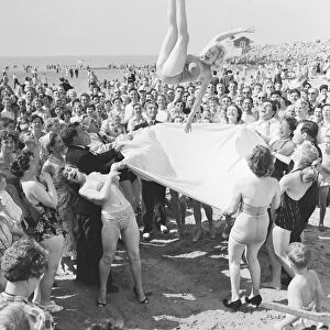 Sunday Pictorial 1957 Beach Party. Angela Manselle seen here being giving the bumps