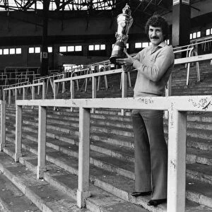 Terry McDermott Liverpool midfielder holding Player of the Year Trophy at The Kop