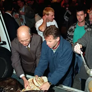 TOMMY BURNS CELTIC MANAGER AND FERGUS McCANN WHO ASSISTED THE CHARITY WORKERS IN FEEDING