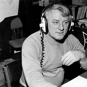 Tommy Docherty listens to a point view from a radio listener. December 1981 P011236