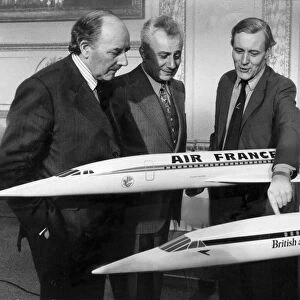 Tony Benn with Marcel Cavaille and Lord Beswick with models of Concorde during its