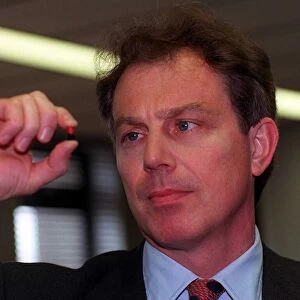 Tony Blair Labour leader holding tablet. 1990s