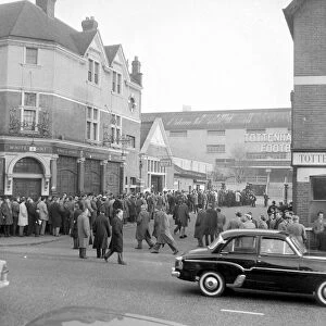 Tottenham supporters queue outside White Hart Lane for tickets to their European Cup