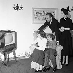 Tv presenter Hughie Green seen here at home with his family. 4th December 1957