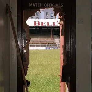 A view through a battered doorway of the stand at Kilbowie Park