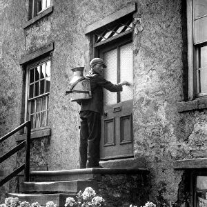 Village milkman George Wake doing his daily rounds in the Yorkshire Dales with his four