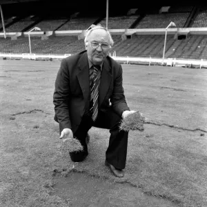 Wembley groundsman Don Gallacher inspects the damage cause by the Scottish fans following