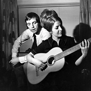 West Bromwich Albions Jeff Astle sings as his wife Laraine plays the guitar at their