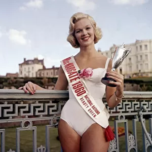 Winner of the Miss Margate beauty pageant posing with trophy at the Winter
