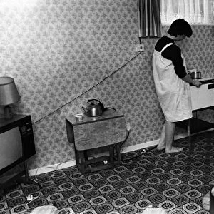 Woman in Bedsit, 23rd September 1982. A one roomed unit of accommodation typically