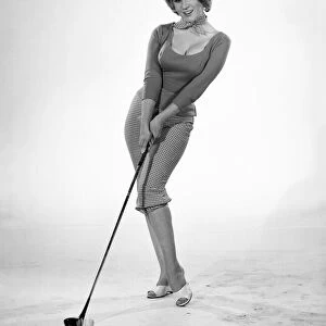 Woman golfer, model Rita Royce. 1960 E389-005