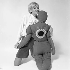 Woman Model with pillows in the shape of man and child. January 1968. Y5