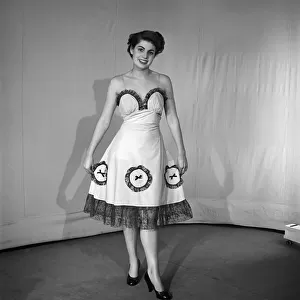 Woman modelling the latest evening dress fashions in the Reveille studios