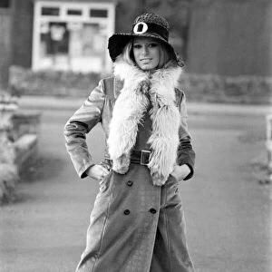 Woman wearing long maxi coat and hat. October 1969 Z10470-002