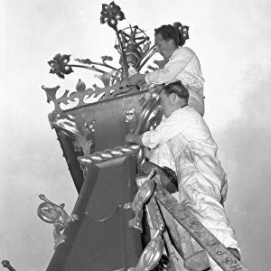 A workmen cleaning the finial of the Queen Elizabeth Tower part of the major overhaul of