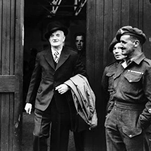 World War Two - Discharged soldier leaving clothes store wearing his demob clothes June