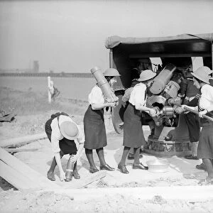 Wrens loading a shore battery on the south coast 1941 Women doing mens jobs during