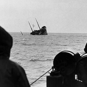 WW2 A British corvette sinks below the waves after hitting a mine dropped in