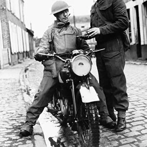 WW2 A dispatch rider from the Hampshire Regiment receives a message from headquarters