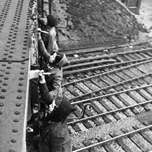 WW2 Female painters at work on a railway bridge in Sheffield