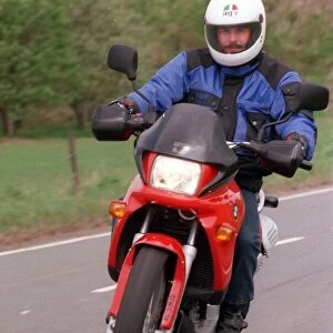 Young Trevor Martin posing on the BMW motor helmetbike circa 1990s BMW F650