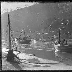 Luggers in Looe harbour mouth approaching Sardine Factory