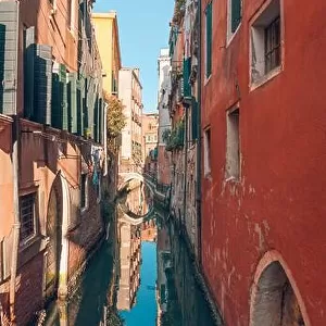 10.09.19 - Traditional canal street with gondola in Venice, Italy. Italy beauty, one of canal streets in, Venezia. Old canal with boats and bridge