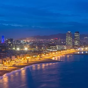 Aerial view of Barcelona Beach in summer night along seaside in Barcelona, Spain. Mediterranean Sea in Spain