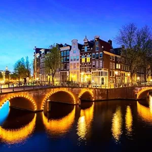 Canals of Amsterdam during twilight in Netherlands. Amsterdam is the capital and most populous city of the Netherlands. Landscape and culture travel