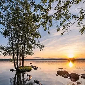 Idyllic landscape with beautiful sunset and tranquil mood at summer evening in Loppi, Finland