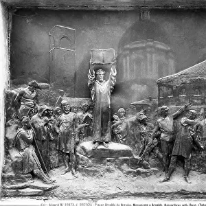 Bas-relief depicting a scene of the life of Arnaldo da Brescia, work of Odoardo Tabacchi. The relief is part of the base of the monument to the priest. Brescia