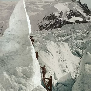 Group of men climbing a glacier on the Mont Blanc