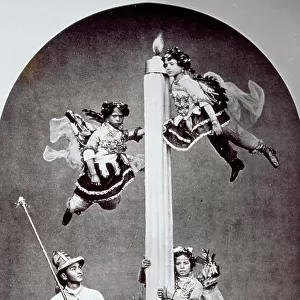 "Living picture" : The complicated composition shows two young little girls dressed as angels and hanging on the sides of a huge votive candle. At its feet there is a third angel, a man wearing XVIth century's clothes and a young boy with a high headgear and holding a long lighting-stick in his hands