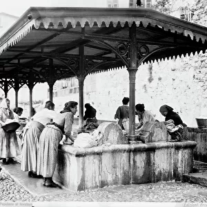 Lower-class women at the public washhouse in old Sanremo
