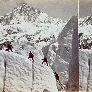 Roped party of mountain climbers on the Bossons glacier. in the background the peak of Aiguille du Midi, near Chamonix
