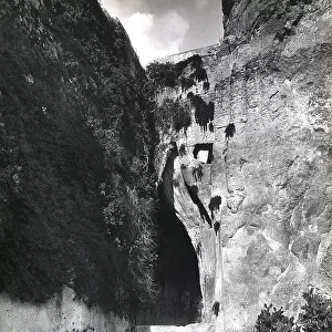 The so-called Ear of Dionysus, an arch-shaped cut in the rock of the Latomia dei Cappuccini (Capuchin Quarry) in Syracuse