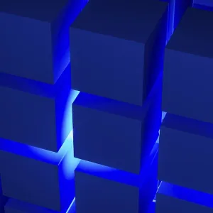 Estructuras cúbicas que destacan por una armoniosa disposición geométrica iluminada con luz azul. Estructuras cúbicas que destacan por una armoniosa disposición geométrica iluminada con luz azul.