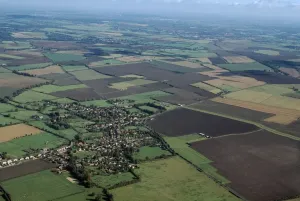Prints of East Hanney, Oxfordshire. An aerial view of the village of East Hanney in Oxfordshire. Photographed in October 1999 England from the Air - Landscapes, Cities and Heritage: East Hanney Village Print, Aerial View