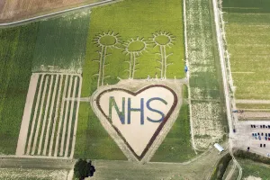 Prints of A field with flowers planted in the shape of a heart in support of the NHS during the coronavirus pandemic (COVID-19), Hayling Island, 2020 Aerial Views of England - Landscapes, Cities and Heritage from Above: Print of a heart-shaped flower field