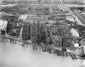 Prints of BARROW-IN-FURNESS, Cumbria. Aerial view of the shipyard in July 1920 with four ships in various stages of completion Engineering And Construction Prints: Aerial view print of Barrow-in-Furness shipyard in 1920