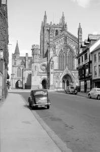 Prints of HEREFORD CATHEDRAL, Hereford, Herefordshire. An exterior view looking towards the west front of the Cathedral from King Street. The west front was built by Oldrid Scott Herefordshire Prints: Hereford Cathedral West Front Print