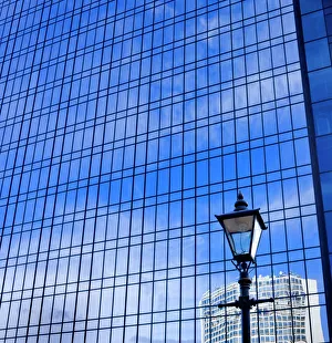 Blue sky reflected in glass tower block DP069226 Blue sky reflected in glass tower block DP069226