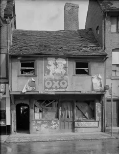 Prints of The bomb damaged front elevation of 4 Gosford Street, Coventry. Photographed by G B Mason, 1941. Oxo poster advertisement Poster Prints: Print of Coventry 1941: Damaged Gosford Street Building