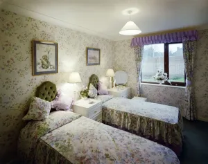 Prints of Oak Lodge, Cambridge Road, Wanstead, Redbridge, Greater London. A bedroom in one of the retirement flats at Oak Lodge House And Home Prints: Retirement flat Print: Oak Lodge Bedroom, Wanstead