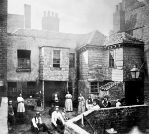 Prints of MARKET COURT, London. A photograph of Market Court on the south side of Kensington High Street, three years before the site was demolished. The inhabitants pose for the camera House And Home Prints: Print of Market Court, a photograph on Kensington High Street