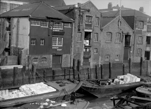 Prints of DUNBAR WHARF, Narrow Street, Limehouse, London. This Thames-side wharf was built in the early 19th century for Duncan Dunbar and Sons Iconic Photographers of England - Historic Image Collections: Dunbar Wharf Print, a 20th-century photograph of a Thames-side wharf