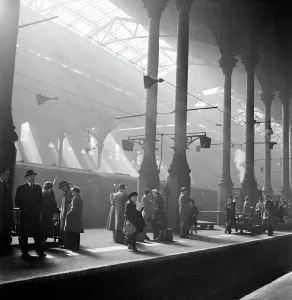 Prints of LIVERPOOL STREET STATION, London. Interior view. Passengers waiting for a train on a platform at Liverpool Street Station. Photographed by John Gay. Date range: 1947-1948 United Kingdom Prints: Liverpool Street Station Print, Interior View