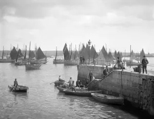 Falmouth Pier Print, a photograph of fishermen unloading their catch