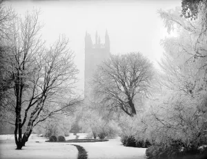 Prints of MAGDALEN COLLEGE, Oxford, Oxfordshire. The 15th century Bell Tower taken from the botanic gardens in the snow. Late 19th / early 20th century. Henry Taunt Iconic Photographers of England - Historic Image Collections: Magdalen College Print, Oxfordshire