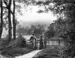 Print of a couple by a country gate in Mickleton, Gloucestershire